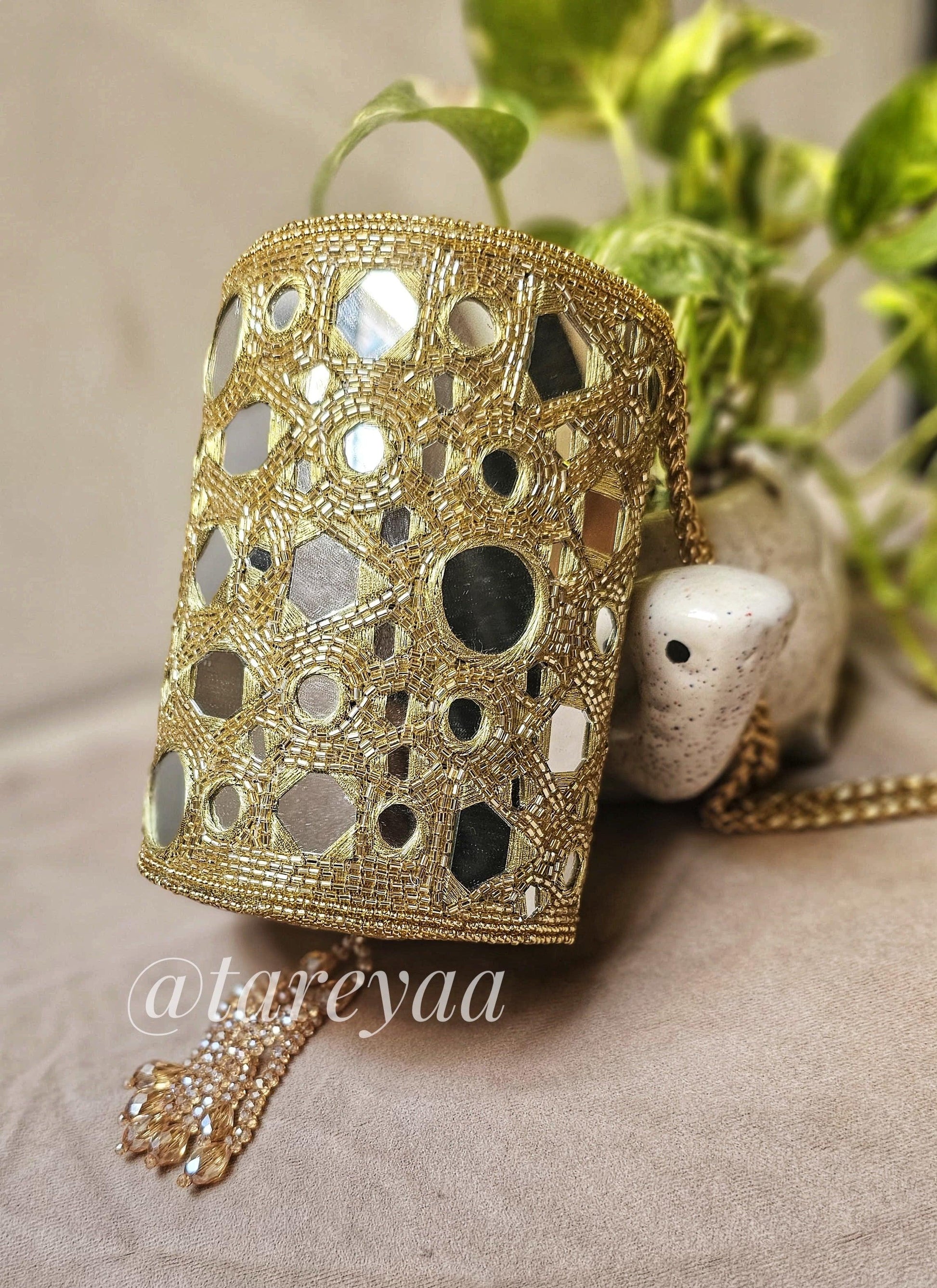 Party Bag featuring a glamorous chandelier mirror minibag with crystal detailing and intricate design.