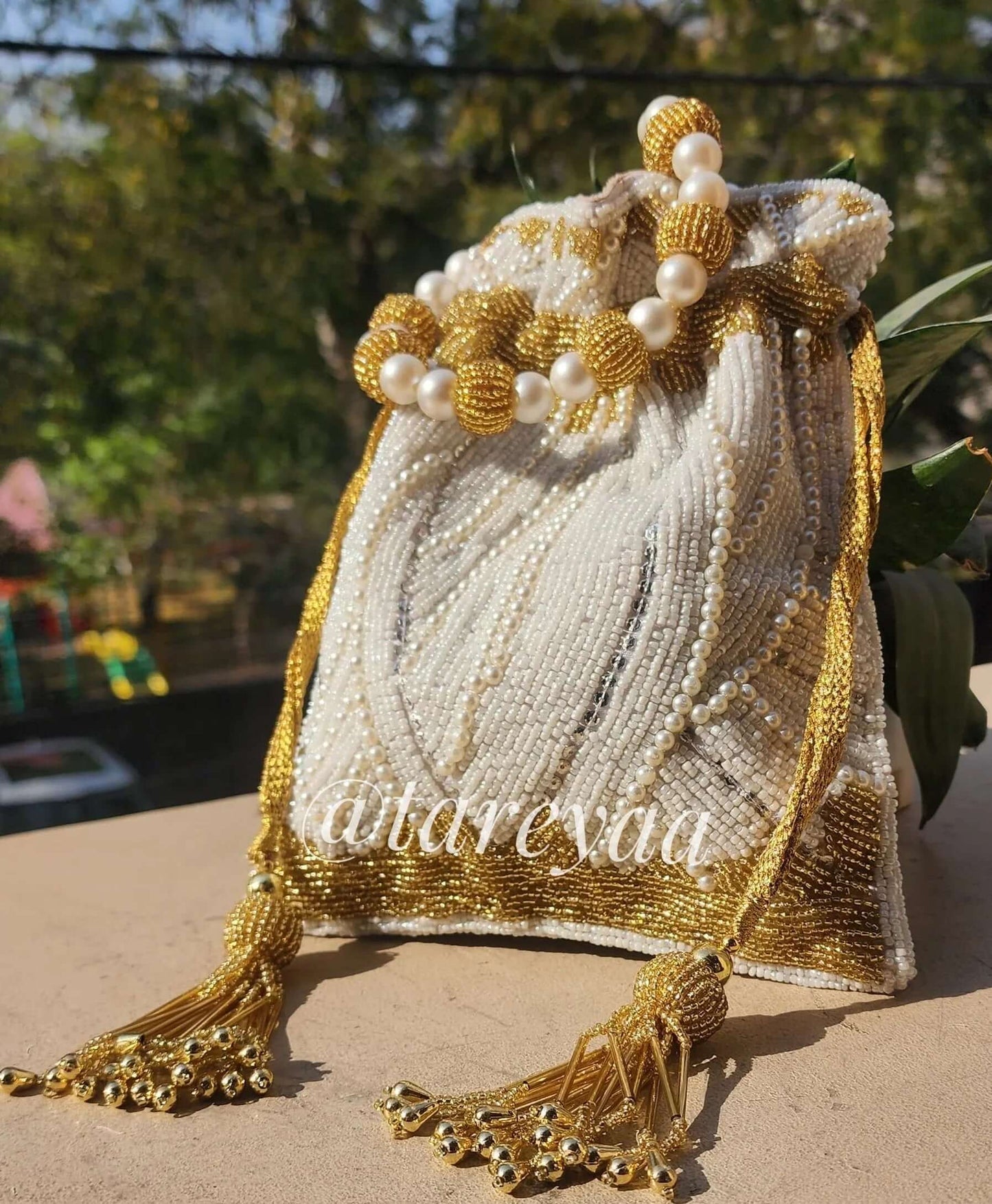 Layla Pearl Potli with pearl handle - Tareyaa