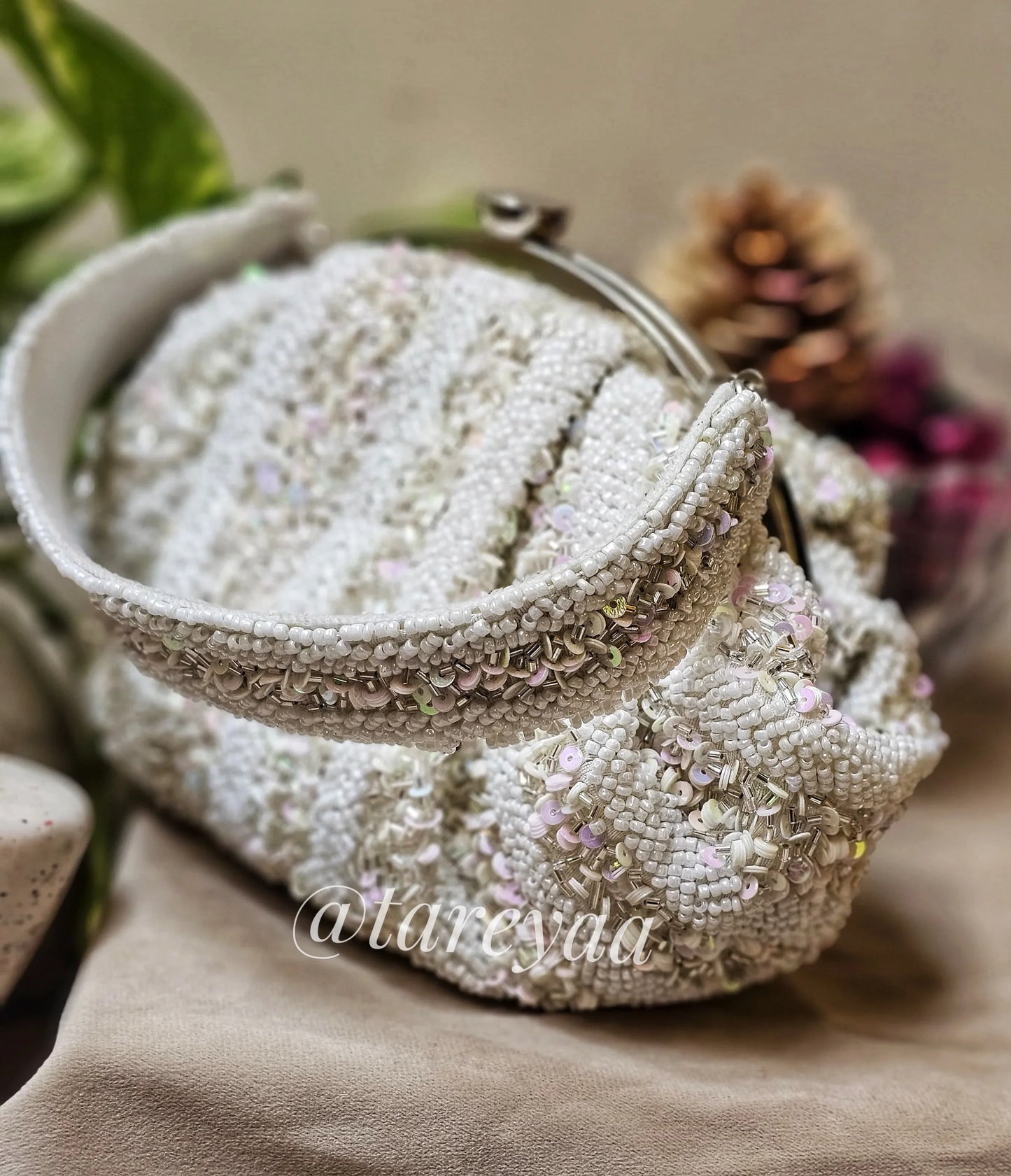 Potli - Ivory Batua Shape White bag with embellished stones and cutdana for a glamorous look.