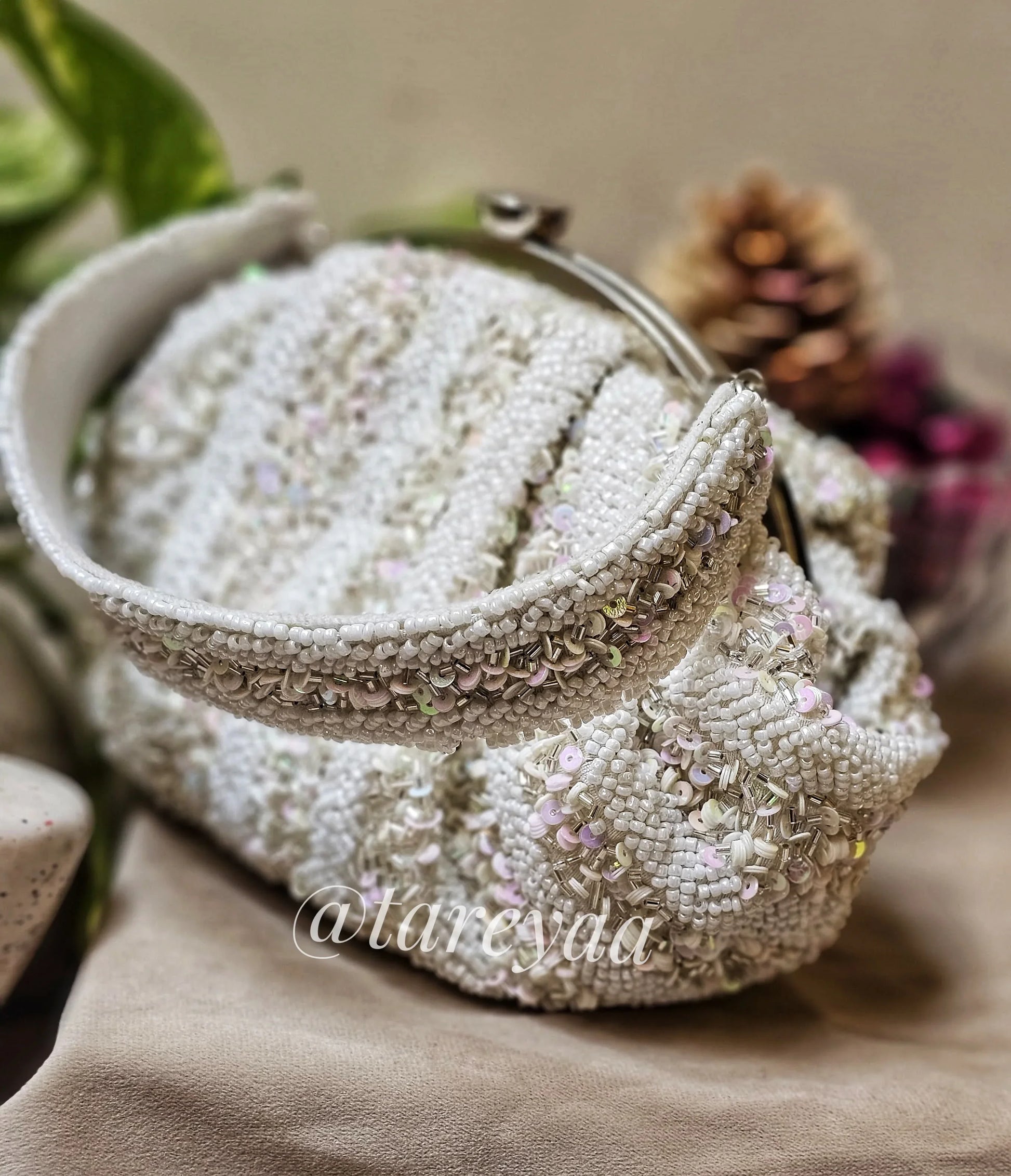 Potli - Ivory Batua Shape White bag with embellished stones and cutdana for a glamorous look.