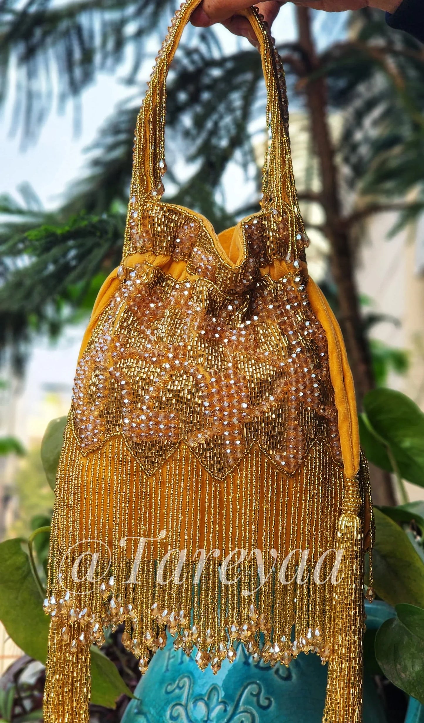 Jodha embedded potli with handle - Tareyaa