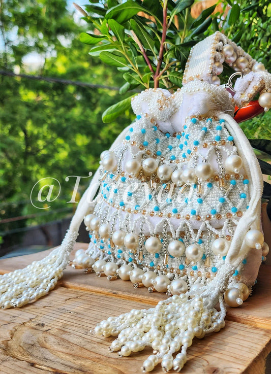 Pearl Delight festive white potli - Tareyaa