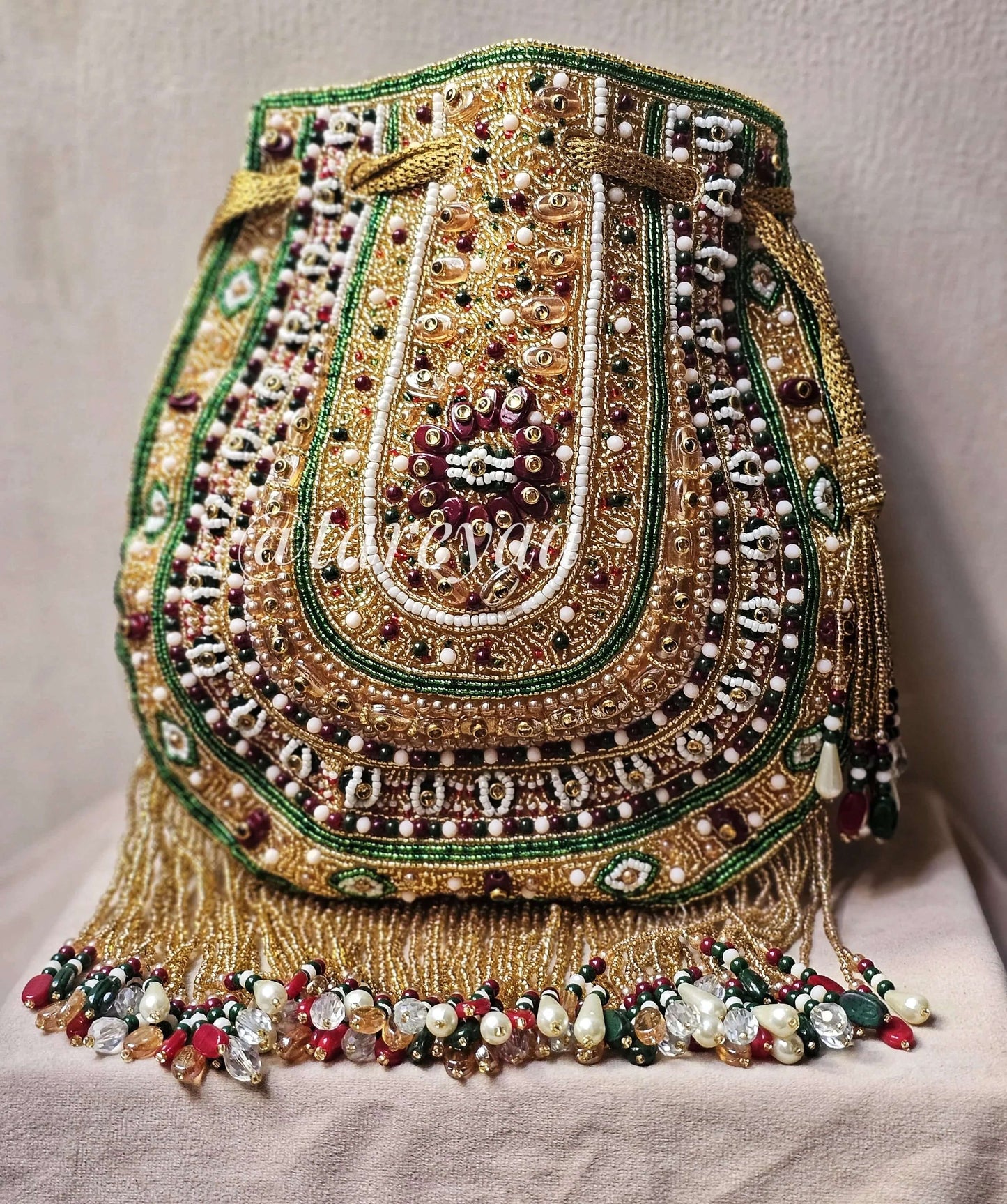 Handmade Qavali Potli - Emerald Multi with intricate beadwork and golden cutdana embellishment, perfect for phone storage.