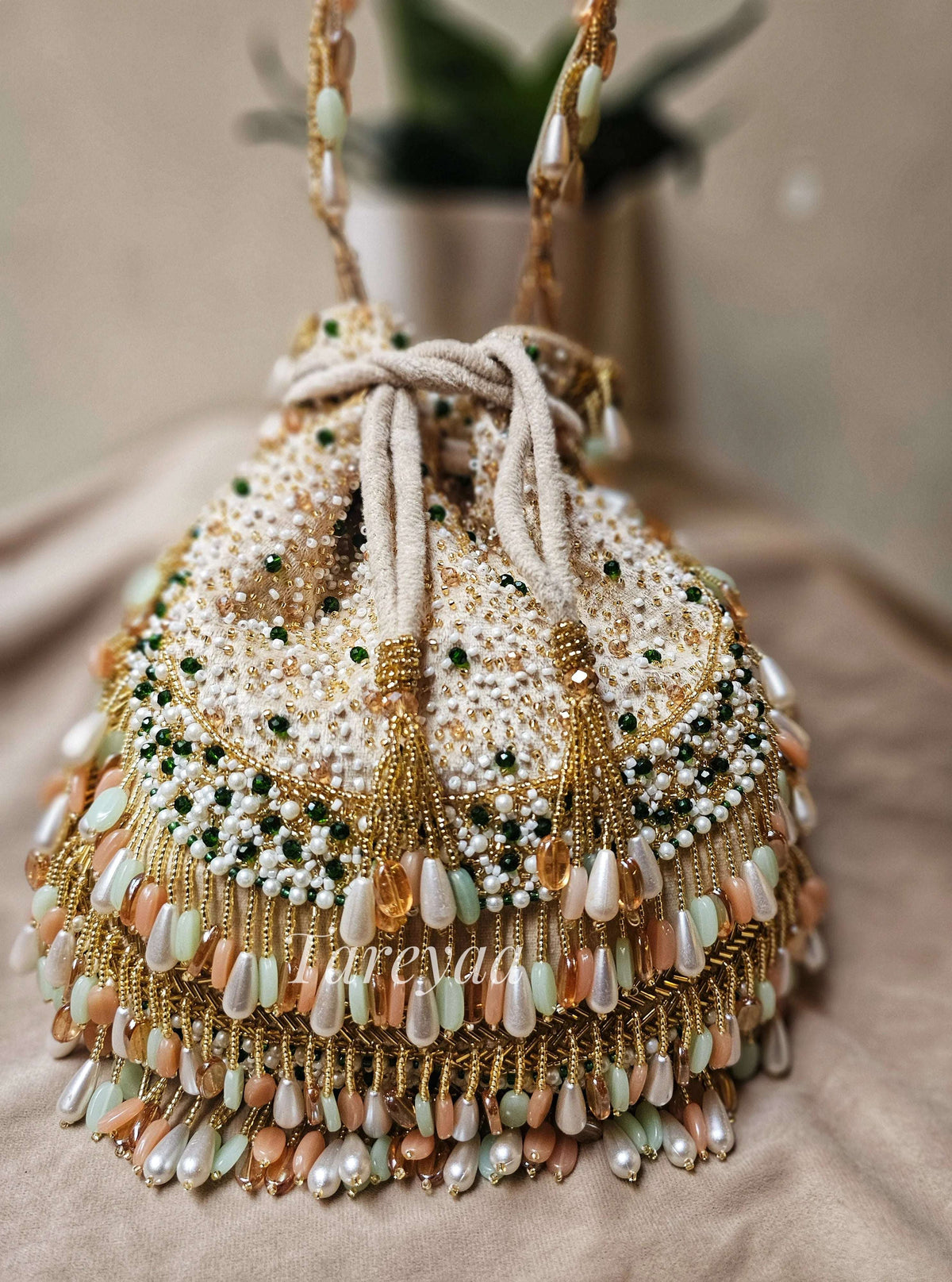 Potli - Antara plush coral beaded beige potli - Tareyaa