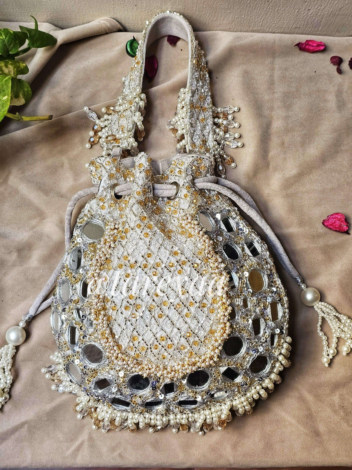Potli - MehNoor Mirror Greytone Potli with Pearlwork showcasing intricate designs and embellishments.
