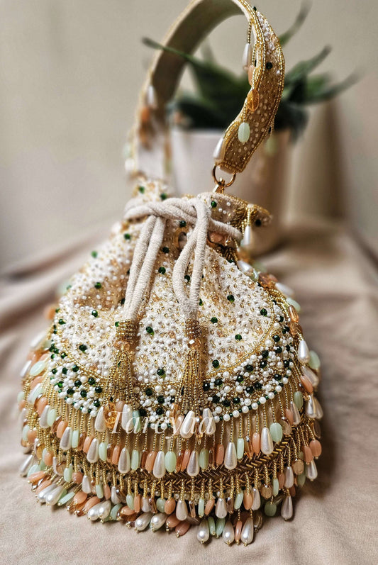 Potli - Antara plush coral beaded beige potli - Tareyaa
