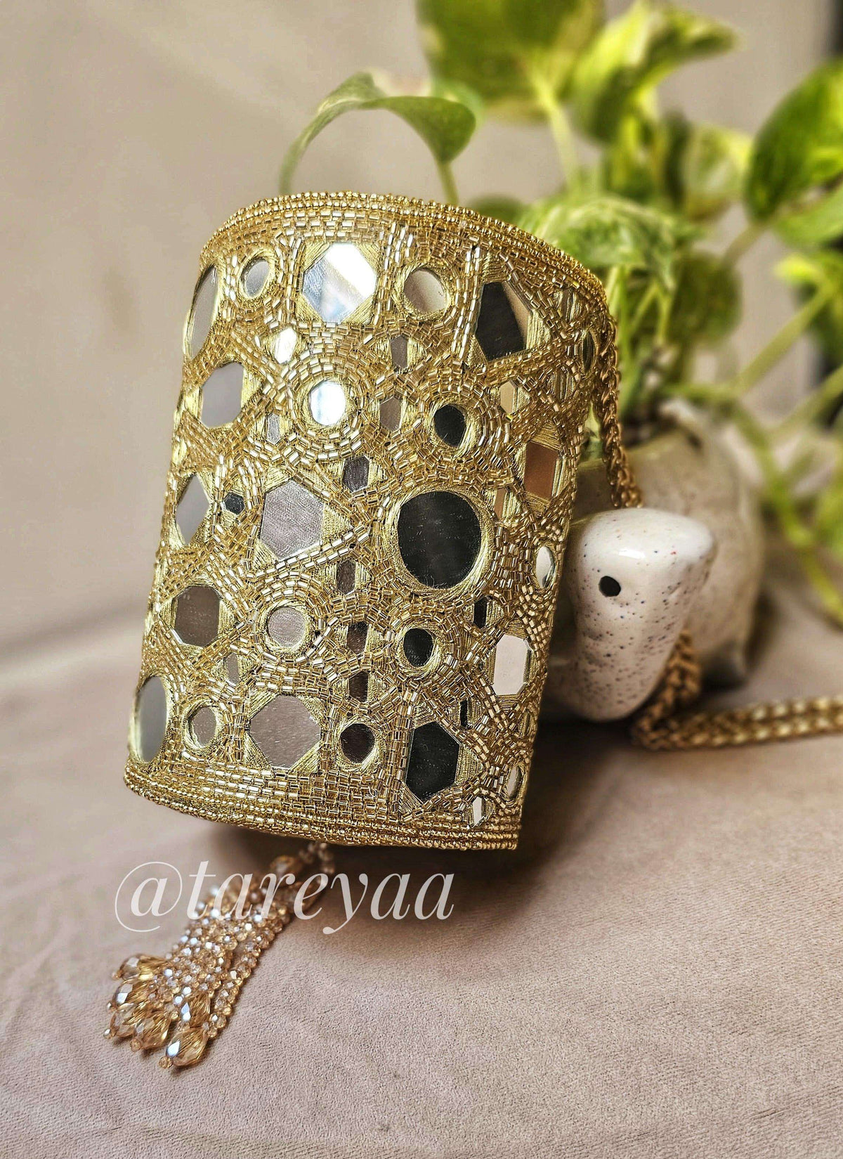 Party Bag featuring a glamorous chandelier mirror minibag with crystal detailing and intricate design.