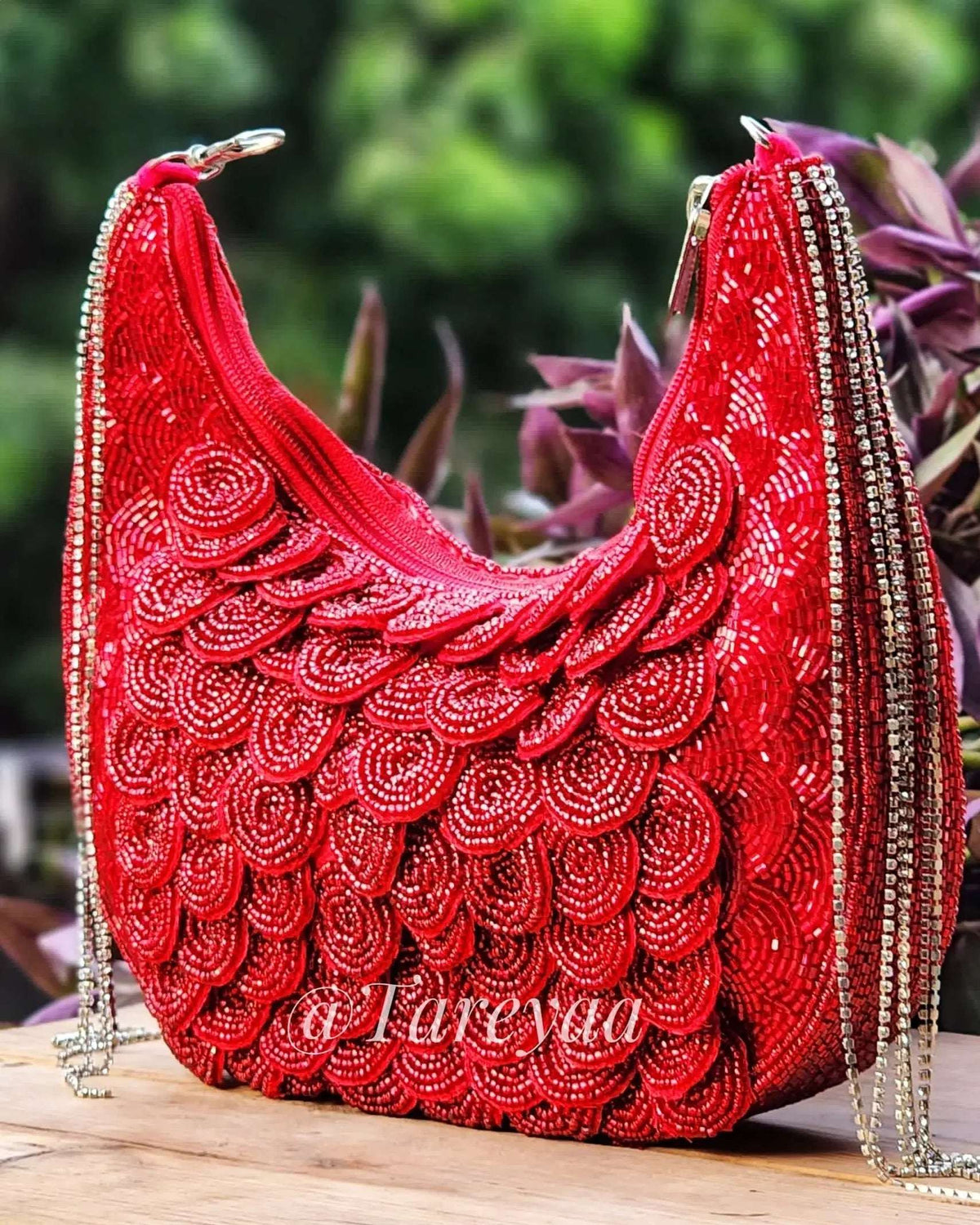 Doll crescent clutch bag in red with stone and cutdana embellishment