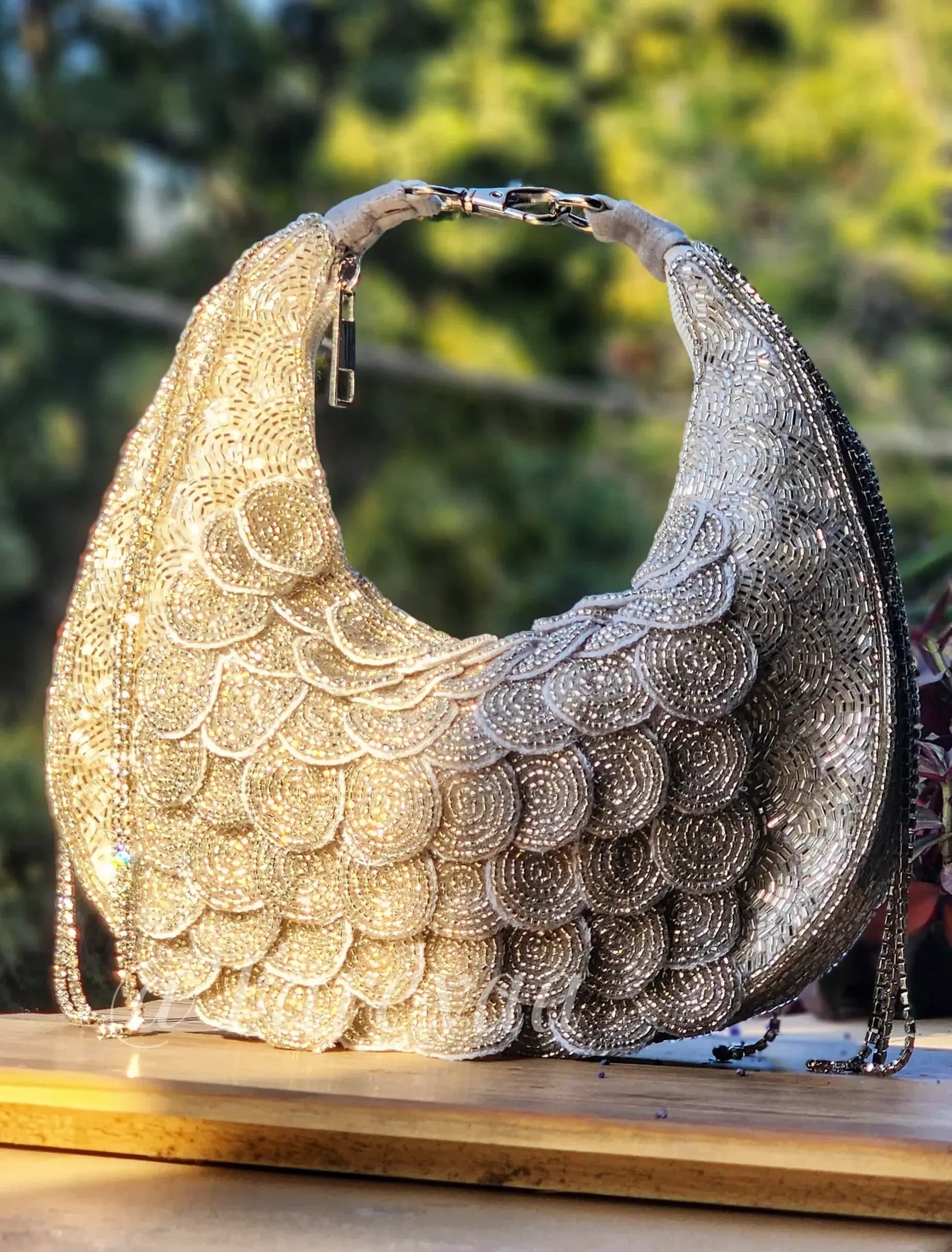 Silver beaded crescent bag close-up showing stonework detail