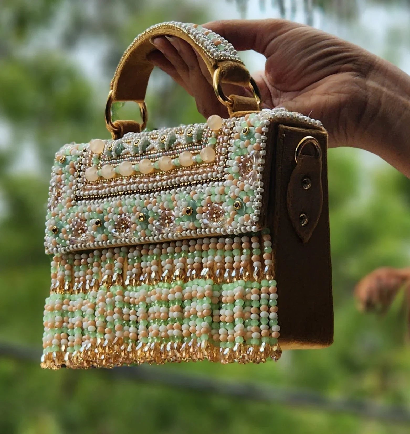 FoldBag Raha bag featuring mint green beadwork and embellished pearls, perfect for stylish outfits.