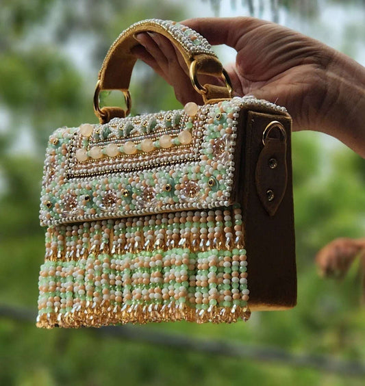 FoldBag Raha bag featuring mint green beadwork and embellished pearls, perfect for stylish outfits.