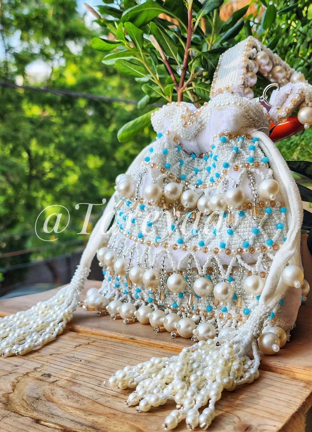 Pearl Delight festive white potli - Tareyaa